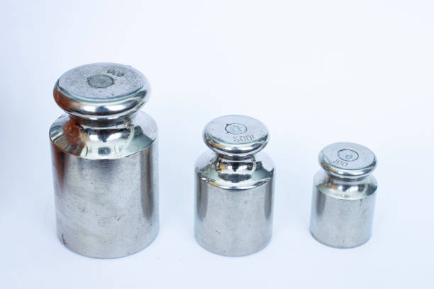 metal weight for measuring mass on a white non-isolated background