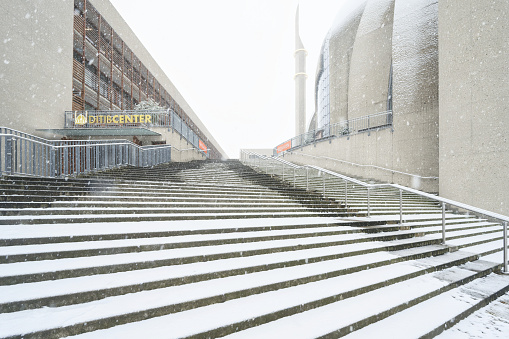 Cologne, Germany January 17 2024: snowfall in cologne at the stairway to the central mosque and ditibcenter