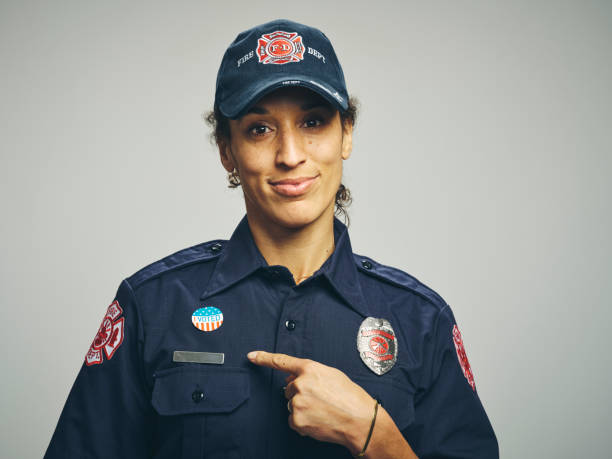 istock Female Firefighter With I VOTED Sticker 1961157378