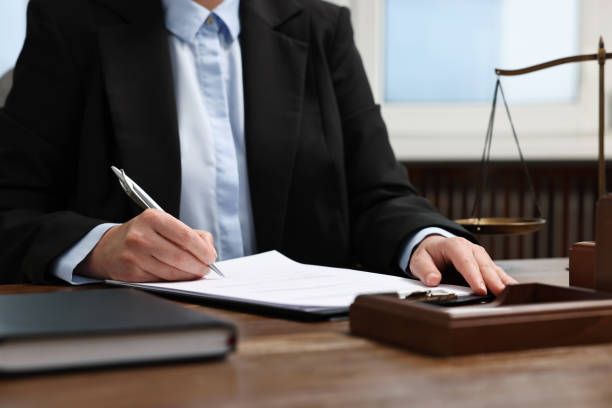 istock Lawyer working at wooden table in office, closeup 1961177205
