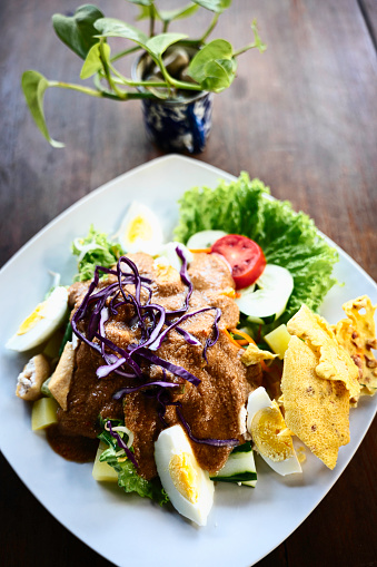 Although Gado-Gado is one of my favorite salads, I rarely eat it when I am where I reside. I tried authentic gado-gado when I travelled to Bali. The sweet peanut sauce dressing is very tasty. It is sweet but you will have various veggies.