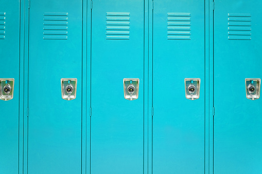 facade view of lockers in school gym painted in light blue