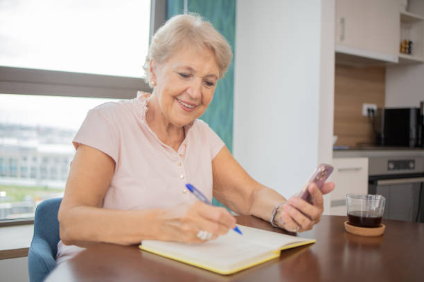 istock Happy senior woman using smartphone 1961211645