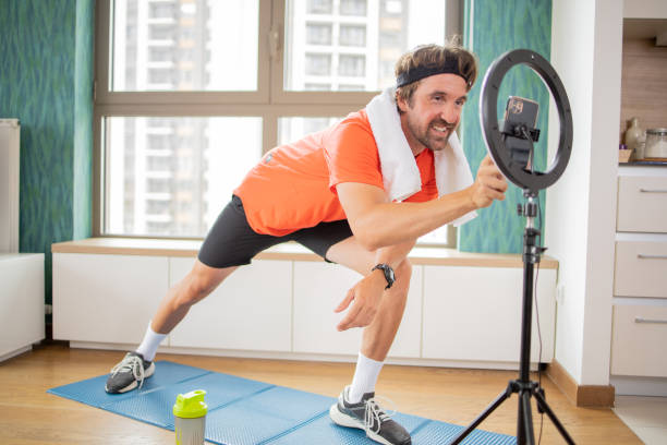 istock Man is recording a vlog about exercise 1961215898