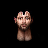 psychological portrait of a person, concept idea art of surreal, double exposure, face shines through hands, surreal portrait of a man covering his face and eyes with his hands