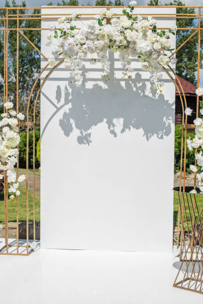 istock Modern Wedding Arch with White Floral Decor 1961352724