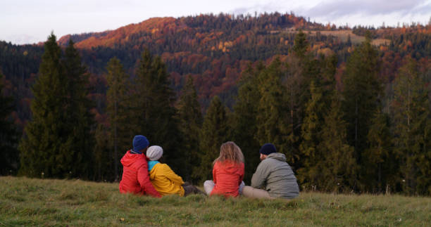 istock Multiethnic couples look at sunset and amazing mountains scenery 1961397956