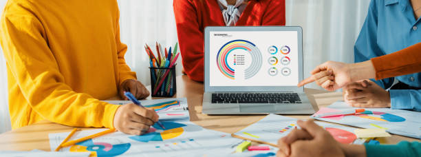 istock Startup company employee working together analyzing BI dashboard paper. Synergic 1961401633