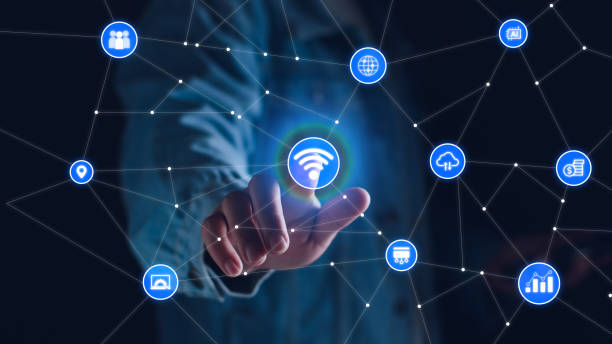 istock Smart business IOT, internet of things concept. Businessman touching IOT icon on virtual screen, connected internet network to access AI intelligence, business analytics, internet investing. 1961402155