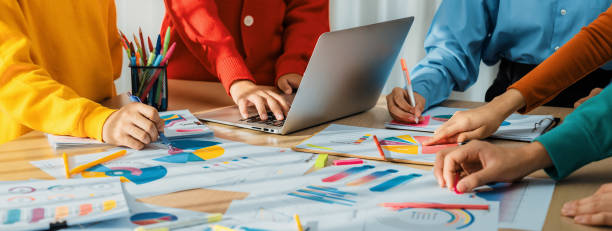 istock Startup company employee working together analyzing BI dashboard paper. Synergic 1961411640