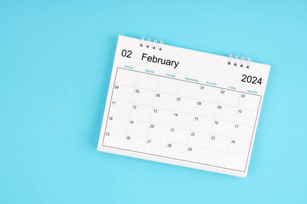 istock February 2024, Monthly desk calendar for 2024 year on blue. 1961429535