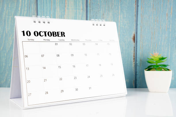 istock October 2024 calendar on the white table with wooden background. 1961430052