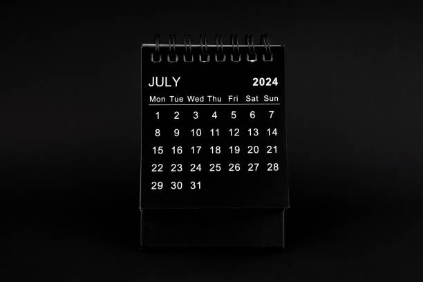 istock Black Calendar for July 2024. Desktop calendar on a black. 1961435441