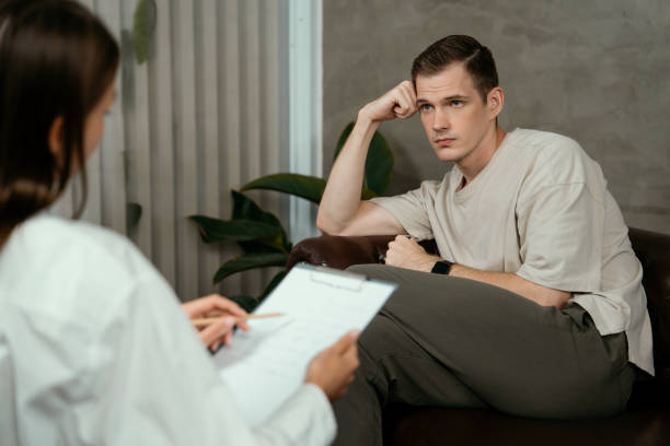 istock Stressed and depressed patient seeking help from psychiatrist. Unveiling 1961455222