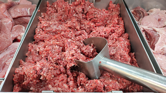 Minced beef is ground red meat mixed with meat fat for cooking. Minced beef in the refrigerated counter in the supermarket.