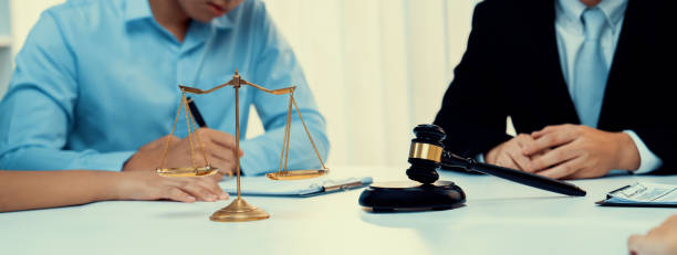 istock Lawyer acting as mediator broke a compromise between two parties. Rigid 1961490068