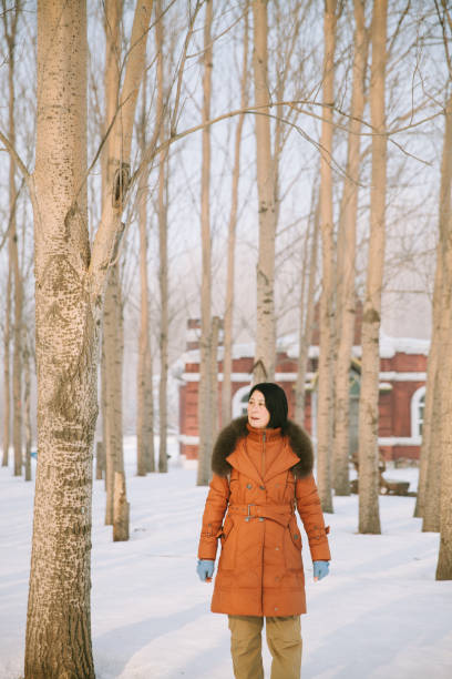 Asian Senior Travelling in Haerbin durig Winter Time