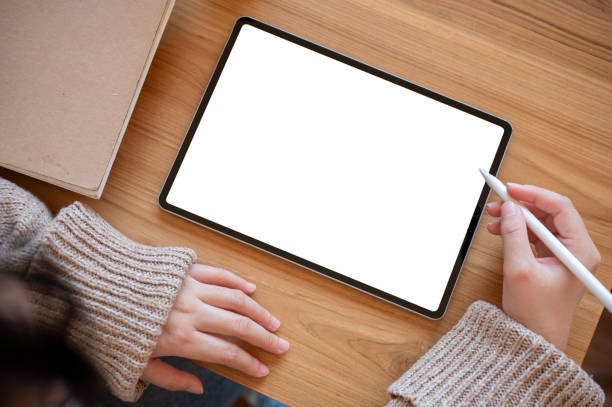istock Top view image of a woman using a digital tablet at her desk. people and technology concepts 1961537574