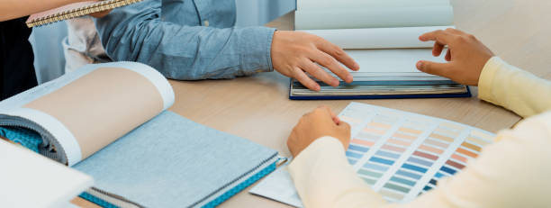 istock Architect and interior designer discussing about curtain material. Variegated. 1961555786