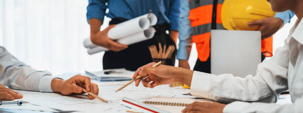 istock Engineer partner drawing and working on blueprint design together. Insight 1961591854