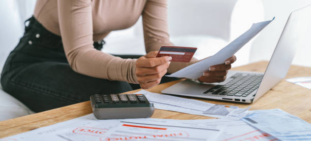 Stressed young woman has financial problems credit card debt to pay crucial Stressed young woman has financial problems with credit card debt to pay crucial show concept of bad personal money and mortgage pay management crisis. sad and unhappy broke stock pictures, royalty-free photos & images