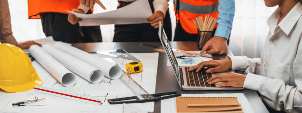 istock Engineer partner drawing and working on blueprint design together. Insight 1961611222