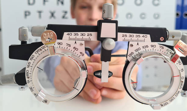 istock Boy holding trial frame to clinic medical optician concept 1961616406