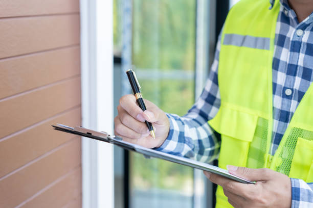 istock inspector or engineer is inspecting construction and quality assurance new house using a checklist. Engineers or architects or contactor work to build the house before handing it over to the homeowner 1961634034