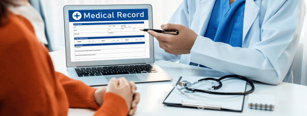 istock Laptop display medical report on blurred doctor office. Rigid 1961678421