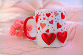 Cup with red hearts and pink gift box. Valentines Day, Birthday, Dating, Mothers Day