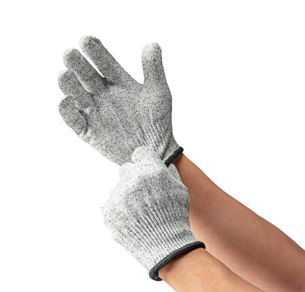 istock Male hand wearing knife-proof gloves on white background. 1961730462