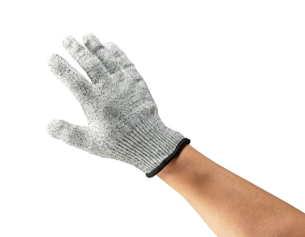 istock Male hand wearing knife-proof gloves on white background. 1961730473