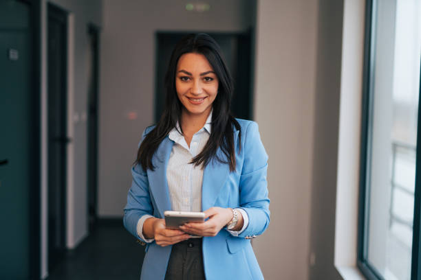 istock Young businesswoman with digital tablet at work 1961779522