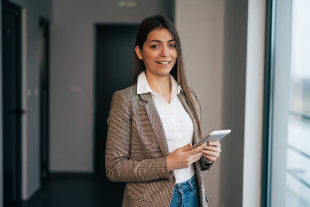 istock Young businesswoman with digital tablet at work 1961779584