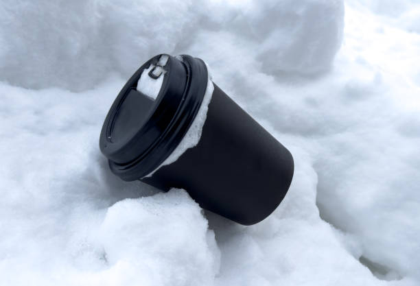 istock Black paper cup on the snow 1961779699