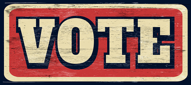 Vintage grunge vote sign on wood