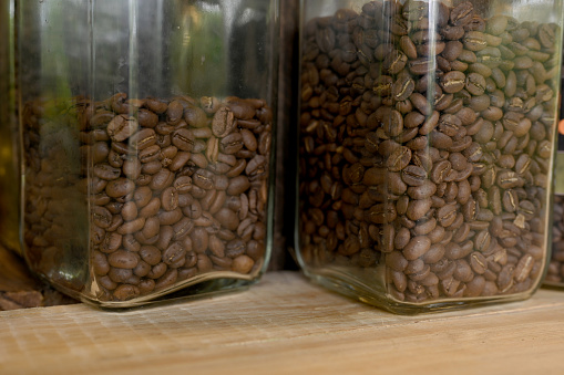 Arabica coffee beans in a jar that have been roasted