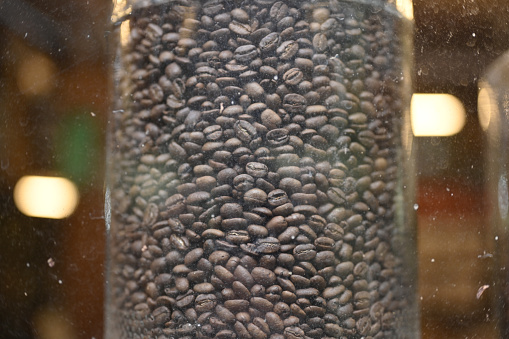 Arabica coffee beans in a jar that have been roasted