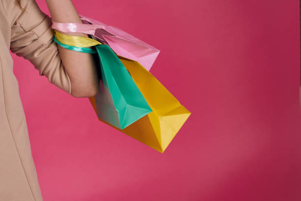 istock Multicolored packages Shopping lifestyle pink background 1961785282