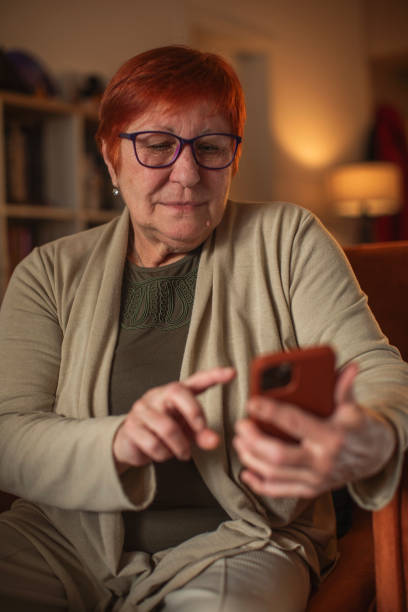 istock Senior woman using mobile phone 1961787739