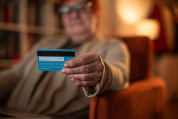 istock Elderly woman with a credit card 1961787995
