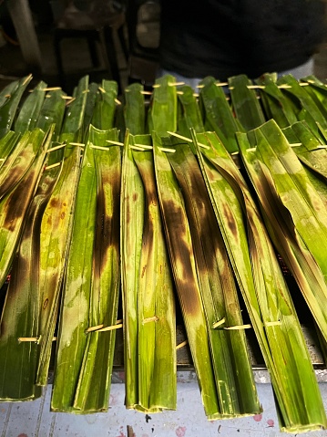 A grilled fish cake known as otak-otak is made of ground fish meat combined with tapioca starch and spices