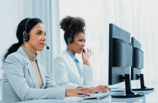 istock Business people wearing headset working in crucial office 1961811151