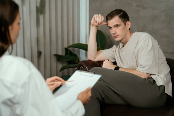 istock Stressed and depressed patient seeking help from psychiatrist. Unveiling 1961844332