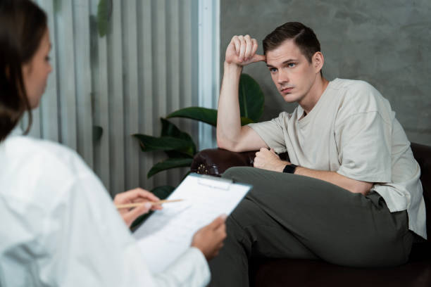 istock Stressed and depressed patient seeking help from psychiatrist. Unveiling 1961852878