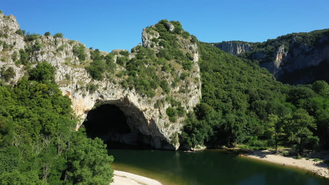 Ardeche in the middle of gorges and green countryside in Europe, France, Pont d'Arc, in summer on a sunny day.