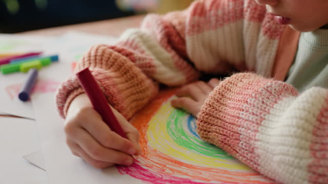 Rainbow, color and girl with art on paper with creative sketch, drawing or development of education. Child, artist and working with creativity and inspiration for project and learning in home