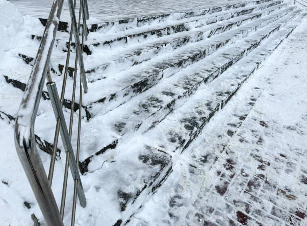 Steps on the stairs in the snow in winter