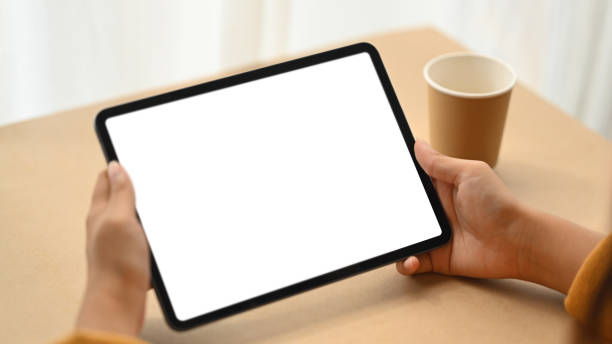 istock Close up woman hands holding digital tablet with empty screen for advertising text 1961912075