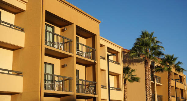 istock rental apartment buildings in a row with palm tree 1961926311